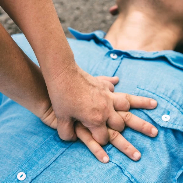a person performing cpr on someone's chest