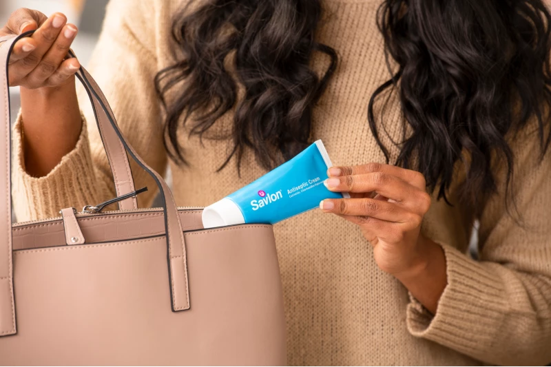 Savlon advanced healing gel being taken out from a family first aid kit in the kitchen